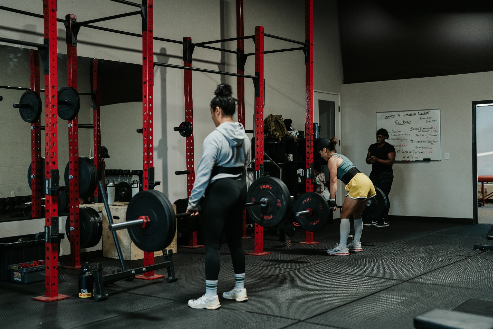 Members training on the floor during a coached group session at LionStrong Athletics